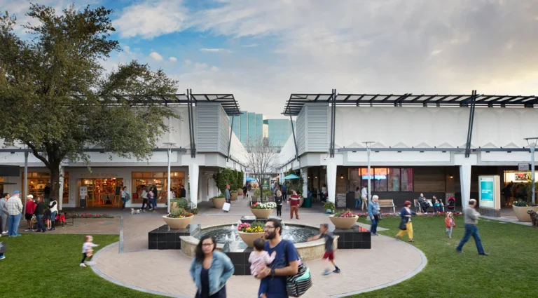 Visitors walking through the central courtyard at Biltmore Fashion Park in Phoenix, Arizona