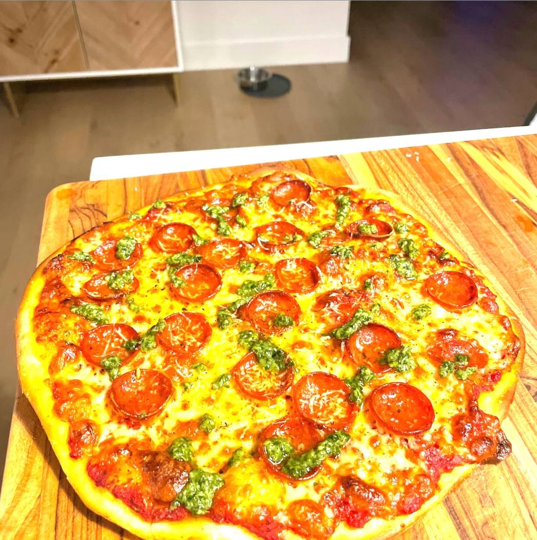 Tavern-style pepperoni pesto pizza.